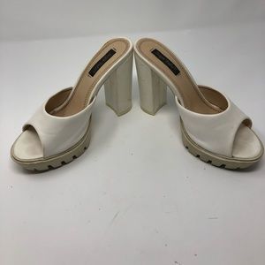Preowned white soft rubber bottom platform mules